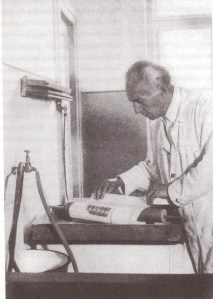 Max Schweidler taking a sheet out of the tray (p. 49)